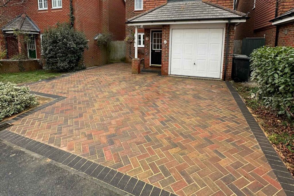 Autumn Mix Herringbone Block Paved Driveway with Charcoal border by Brick by brick construction & Landscape